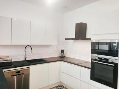 Cuisine ou kitchenette dans l'établissement Okera