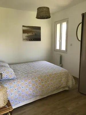 Un ou plusieurs lits dans un hébergement de l'établissement Charmante Cabane Bois
