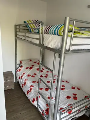 Un ou plusieurs lits dans un hébergement de l'établissement Superbe appartement proche de tout, climatisé.