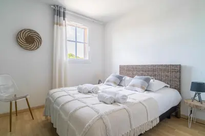 Un ou plusieurs lits dans un hébergement de l'établissement LES RENARDS - Charmante petite maison au port de la Teste