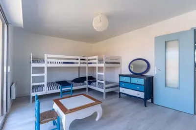 Un ou plusieurs lits dans un hébergement de l'établissement Maison Mimizan plage