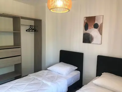 Un ou plusieurs lits dans un hébergement de l'établissement Maison 8 personnes Biscarrosse bourg