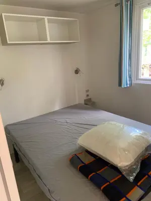 Un ou plusieurs lits dans un hébergement de l'établissement Mobil home 6 personnes camping 4* Mimizan