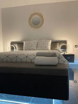 Coin salon dans l'établissement Appartement hors du commun avec son jacuzzi