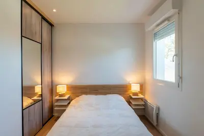 Un ou plusieurs lits dans un hébergement de l'établissement Ravissante maison 3* avec jacuzzi proche lac