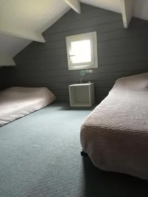 Un ou plusieurs lits dans un hébergement de l'établissement Chalet calme et agréable