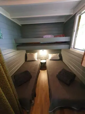 Un ou plusieurs lits dans un hébergement de l'établissement Chalet calme et agréable