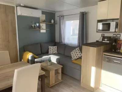 Cuisine ou kitchenette dans l'établissement mobil home chez fred