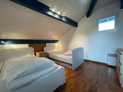 Un ou plusieurs lits dans un hébergement de l'établissement Spacieuse villa avec véranda et jardin à Capbreton - FR-1-413-209