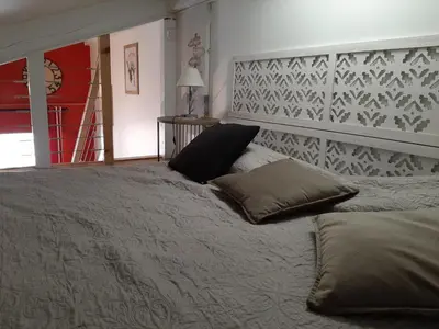 Un ou plusieurs lits dans un hébergement de l'établissement Duplex cosy avec piscine et parking à Capbreton - FR-1-239-870