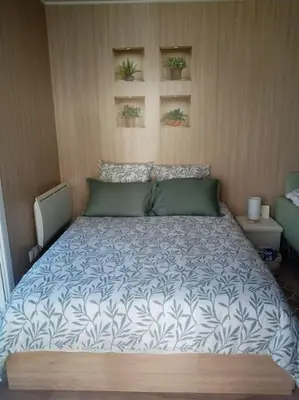 Un ou plusieurs lits dans un hébergement de l'établissement Le Maluti - Chalet climatisé à Hostens