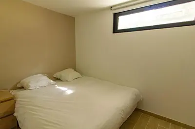 Un ou plusieurs lits dans un hébergement de l'établissement Pyla sur mer proche plages appartement avec piscine partagée