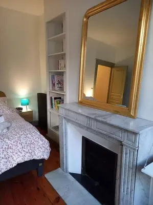 Un ou plusieurs lits dans un hébergement de l'établissement Maison Nadaud avec parking privé