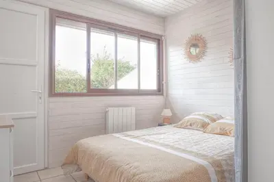 Un ou plusieurs lits dans un hébergement de l'établissement Appartement cosy au calme