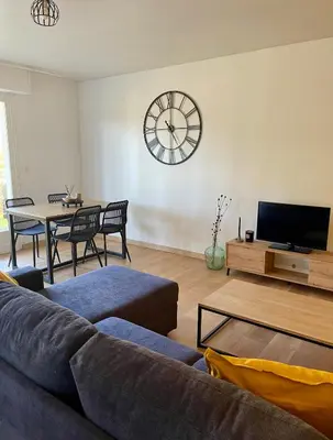 Télévision ou salle de divertissement dans l'établissement L'Ocenoa2
