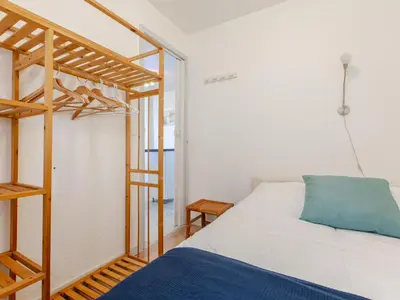 Un ou plusieurs lits dans un hébergement de l'établissement Apartment Les Bourdaines by Interhome