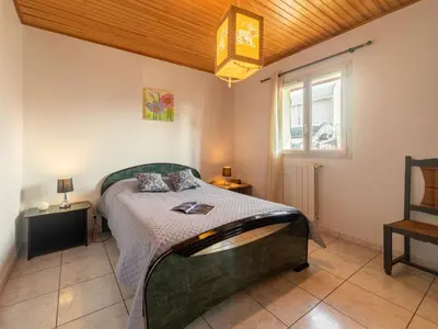Un ou plusieurs lits dans un hébergement de l'établissement Holiday Home La Gare by Interhome
