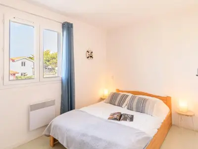 Un ou plusieurs lits dans un hébergement de l'établissement Holiday Home Le Hameau des Pêcheurs-2 by Interhome