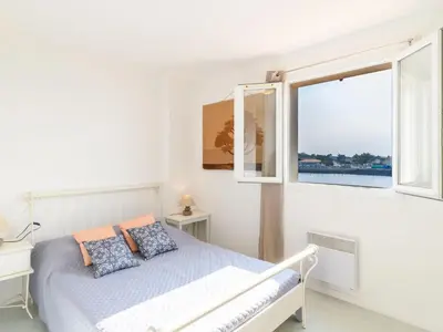 Un ou plusieurs lits dans un hébergement de l'établissement Holiday Home Le Hameau des Pêcheurs-2 by Interhome