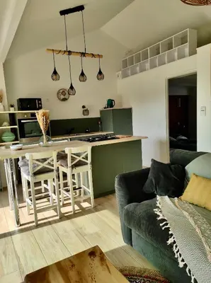 Cuisine ou kitchenette dans l'établissement Maisonnette neuve plage et commerces à pied
