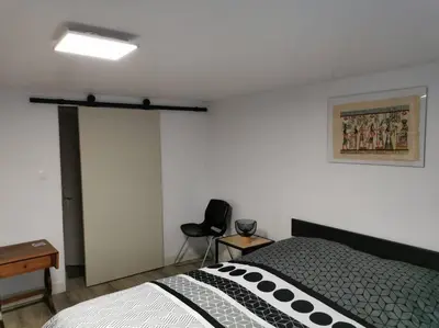 Un ou plusieurs lits dans un hébergement de l'établissement Appartement 5 personnes avec piscine 60m2