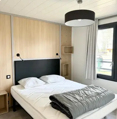 Un ou plusieurs lits dans un hébergement de l'établissement Chalet à louer - 52m2 - Landes