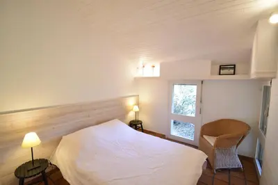 Un ou plusieurs lits dans un hébergement de l'établissement Tiokers - Hossegor - Confortable villa sur terrain clos idéalement située entre lac et Océan et à 1200m du centre ville