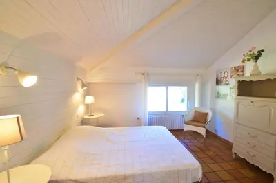 Un ou plusieurs lits dans un hébergement de l'établissement Tiokers - Hossegor - Confortable villa sur terrain clos idéalement située entre lac et Océan et à 1200m du centre ville