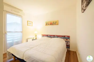 Un ou plusieurs lits dans un hébergement de l'établissement Biscarrosse Bourg Charmant appartement T3 en centre ville
