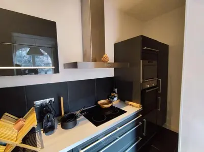 Cuisine ou kitchenette dans l'établissement Le Moulleau Appartement 2 chambres - plage à 50m