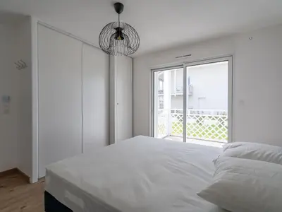 Un ou plusieurs lits dans un hébergement de l'établissement Appartement Neuf 3* à Mimizan - 100m de l'Océan, Piscine, Clim, WiFi, 4 Pers, Ménage inclus - FR-1-50-112