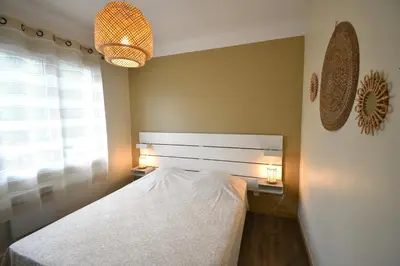 Un ou plusieurs lits dans un hébergement de l'établissement Anlga - Hossegor villa mitoyenne de plain pied rénovée avec jardinet clos et terrasse