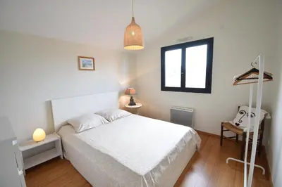 Un ou plusieurs lits dans un hébergement de l'établissement Carolins - Saubion agréable villa en bois dans quartier résidentiel à 400m du bourg de saubion