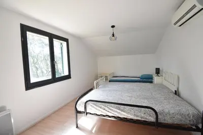Un ou plusieurs lits dans un hébergement de l'établissement Marcassins - Hossegor belle villa landaise avec grand jardin location vacances