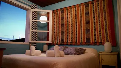 Un ou plusieurs lits dans un hébergement de l'établissement Guesthouse Évasion