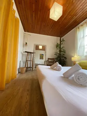 Un ou plusieurs lits dans un hébergement de l'établissement Guesthouse Évasion