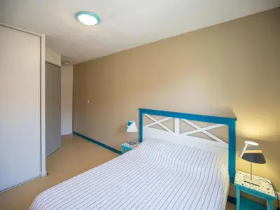 Un ou plusieurs lits dans un hébergement de l'établissement Résidence Vacancéole Sun Hols Les Villas du Lac