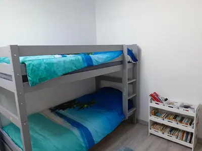 Un ou plusieurs lits superposés dans un hébergement de l'établissement Mimizan Apt neuf 80m2 +terrasse 100m plage